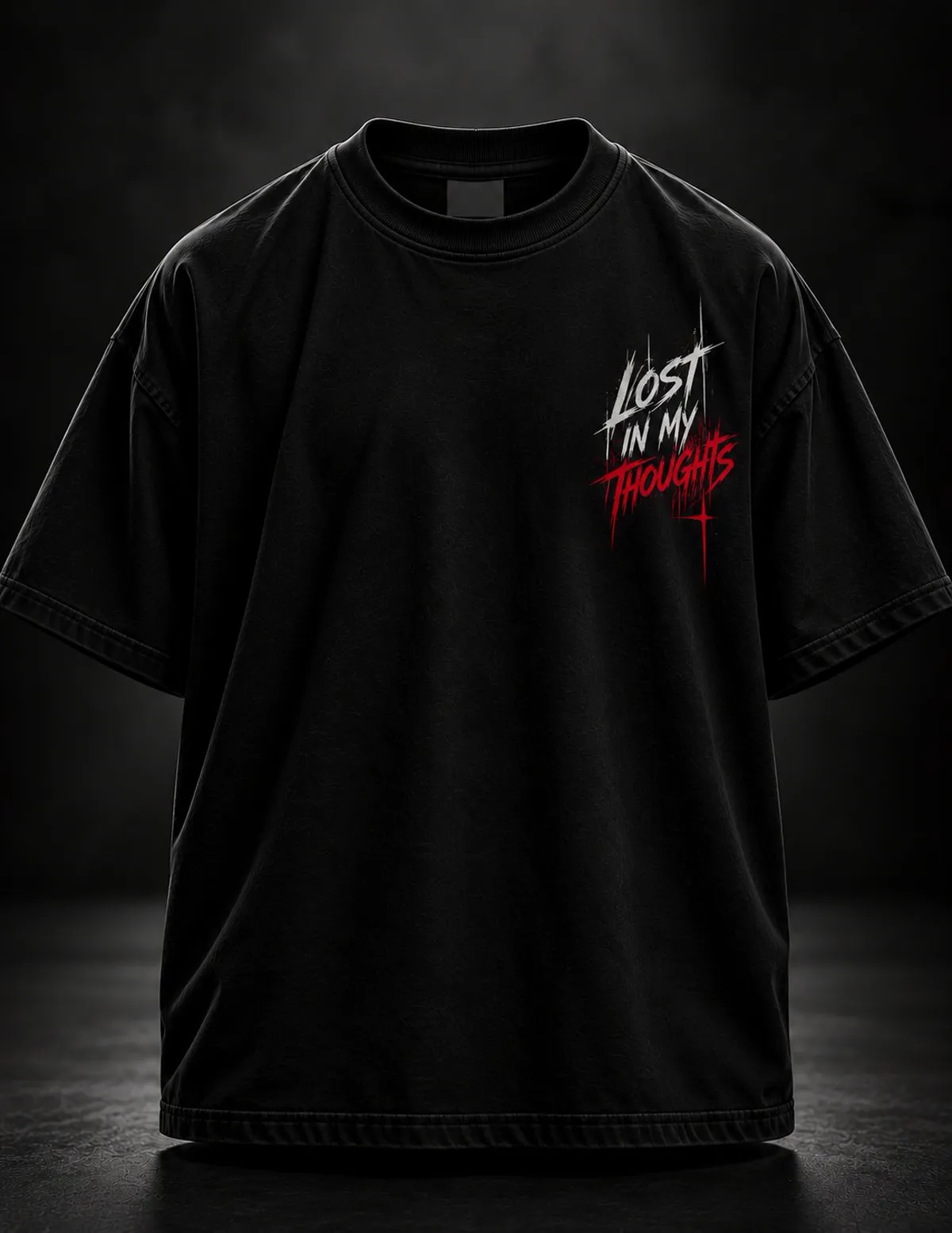 Black oversized T-shirt, front: small LOST IN MY THOUGHTS chest print in white and red script
