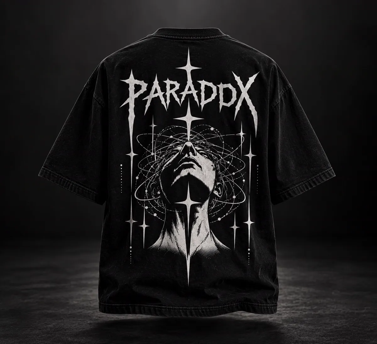 Black oversized T-shirt, back: PARADOX lettering above a face with orbital rings